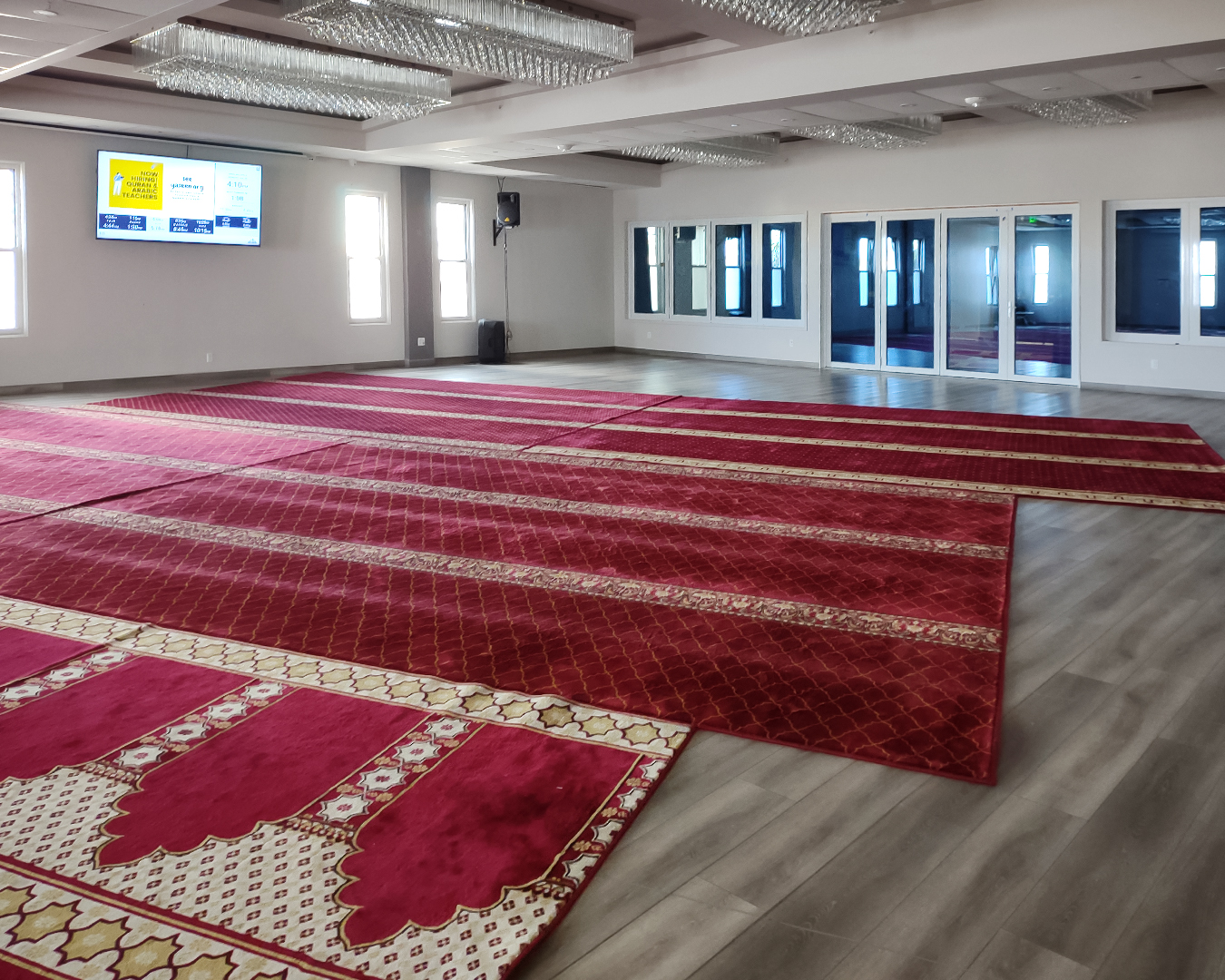 Georgia Windows & Doors white aluminum bi-fold doors and windows — mosque prayer hall commercial installation Burlingame California